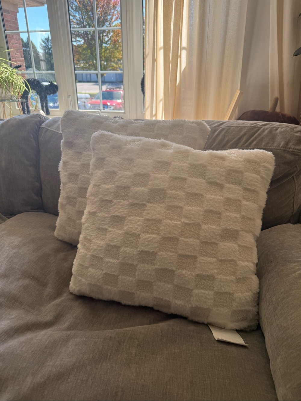 White checkered / checked pillow in a bouclé style